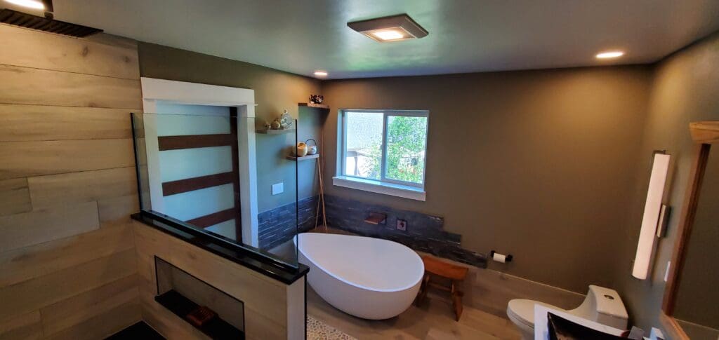Custom primary bathroom remodel with freestanding tub and tiled shower in Sandy, Oregon