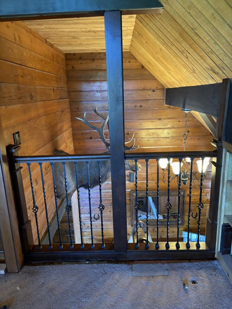 Custom wood and wrought iron staircase and loft railing remodeled in a Sandy, Oregon home