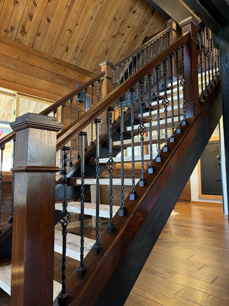Custom wood and wrought iron staircase and loft railing remodeled in a Sandy, Oregon home